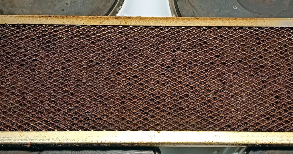 Aluminum mesh range hood filter clogged with grease and dust